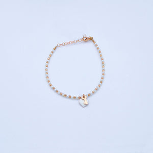 Bracciale perline e palline rosa con ciondoli smalto e chiave/lucchetto  Ref. B 298